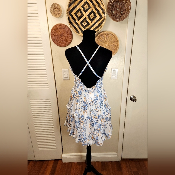 LAST ONE! Blue And White Floral Mini Dress With Ruffles And Criss-Cross Back - Picture 10 of 11